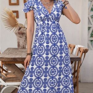 NWT Cupshe dress. MIDI length, beautiful white and blue design